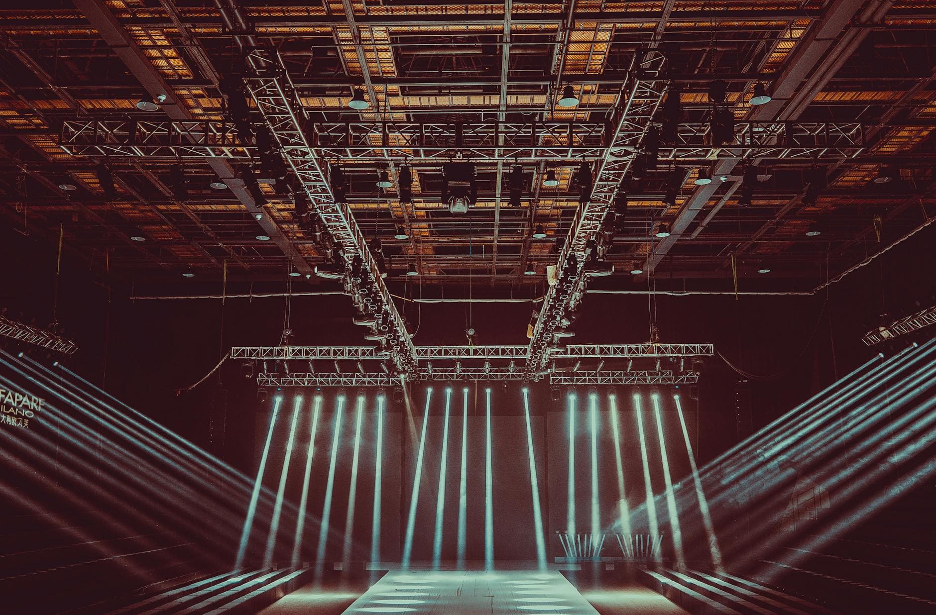 Arena stage with red truss, top-down view