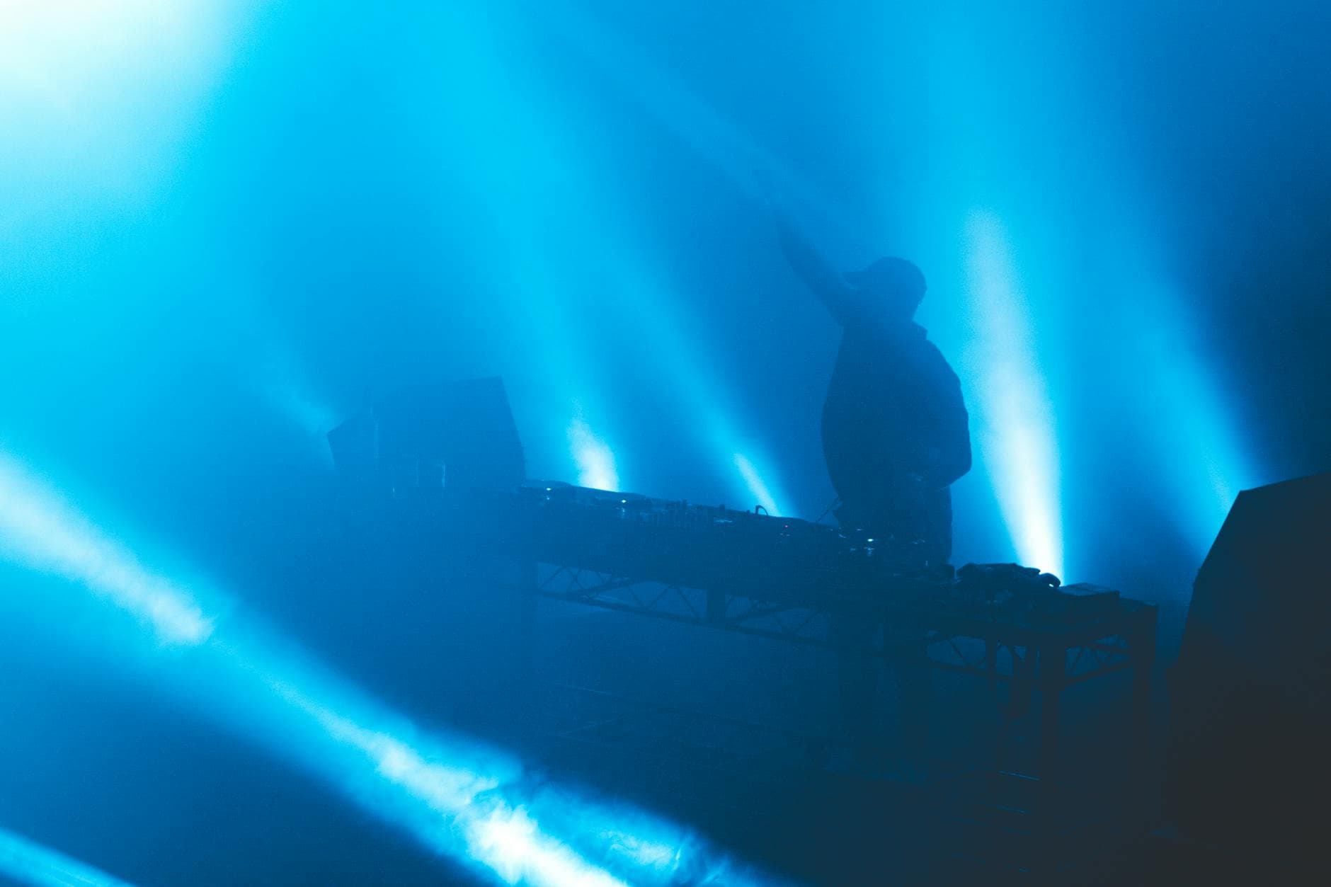 Blue-lit silhouette performer on stage