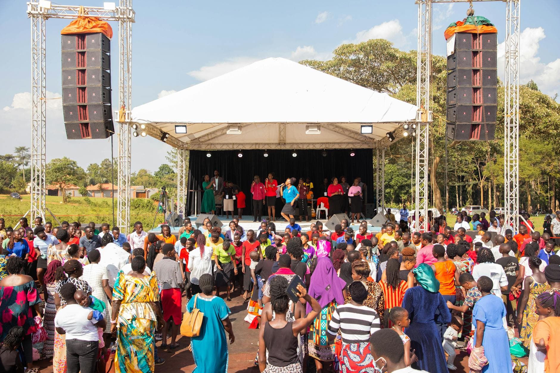 Line-array speakers at an outdoor tent event