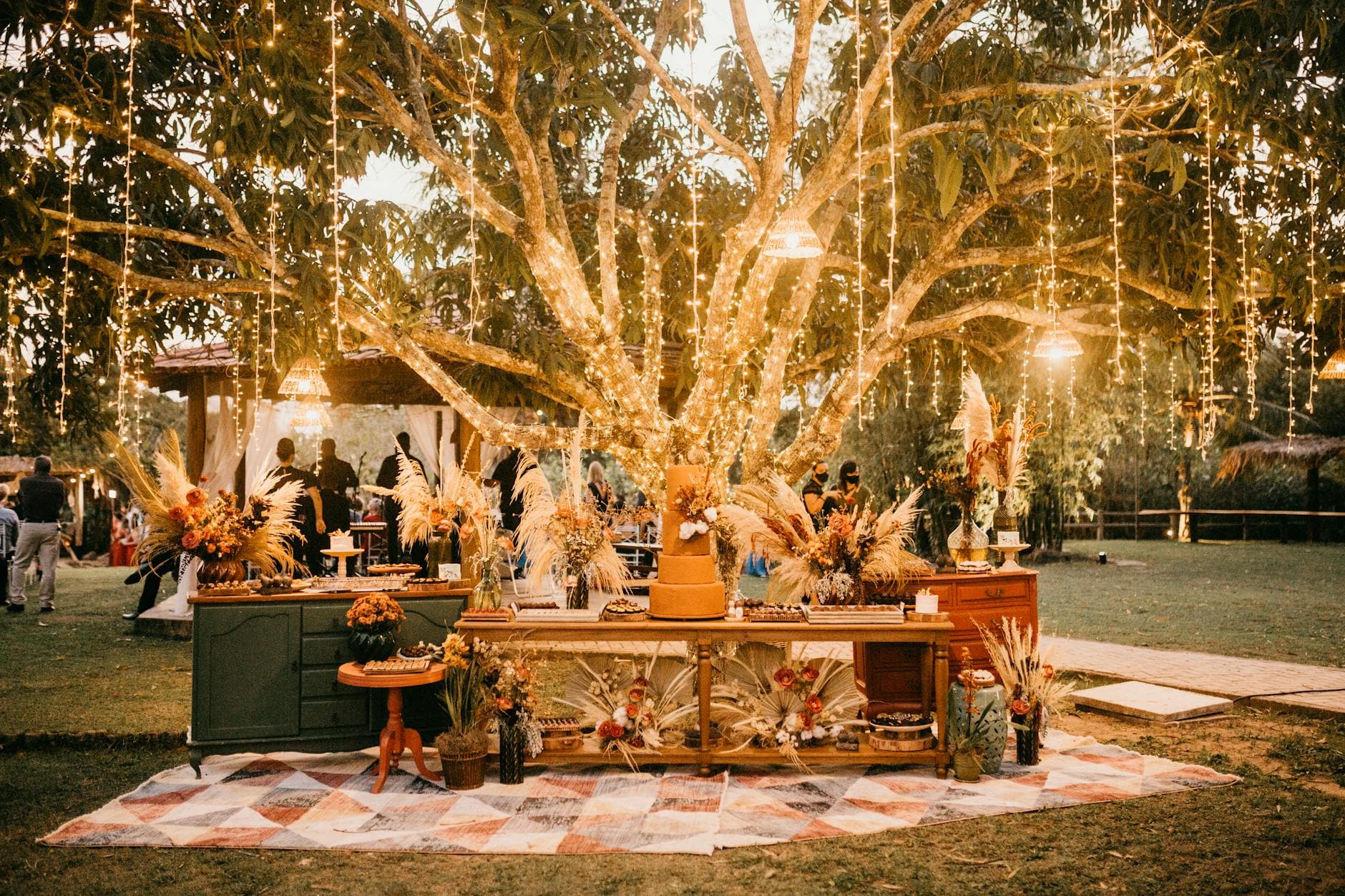 Outdoor wedding reception with string lights